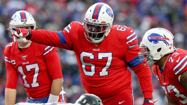 ORCHARD PARK, NEW YORK - DECEMBER 08: Quinton Spain #67 of the Buffalo Bills signals to teammate Dion Dawkins #73 during the fourth quarter of an NFL game against the Baltimore Ravens at New Era Field on December 08, 2019 in Orchard Park, New York.