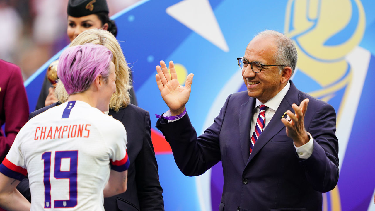 LYON, FRANCE - JULY 07: Megan Rapinoe #15 of the United States is greeted by US Soccer president Carlos Cordeiro after the 2019 FIFA Women's World Cup France final match between the Netherlands and the United States at Stade de Lyon on July 07, 2019 in Lyon, France.