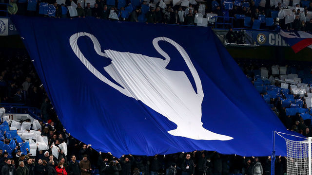 LONDON, ENGLAND - FEBRUARY 25: Fans of Chelsea hold up a tifo display with a giant UEFA Champions League trophy on during the UEFA Champions League round of 16 first leg match between Chelsea FC and FC Bayern Muenchen at Stamford Bridge on February 25, 2020 in London, United Kingdom.
