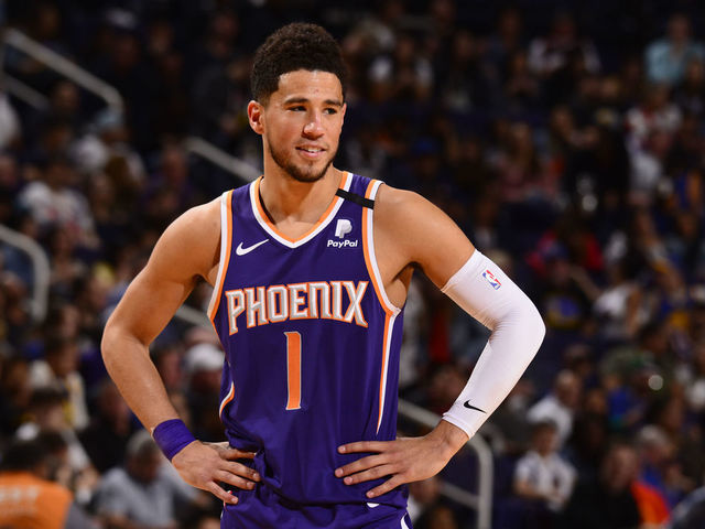 PHOENIX, AZ - FEBRUARY 29: Devin Booker #1 of the Phoenix Suns smiles before the game against the Golden State Warriors on February 29, 2020 at Talking Stick Resort Arena in Phoenix, Arizona. Mandatory Copyright Notice: Copyright 2020 NBAE