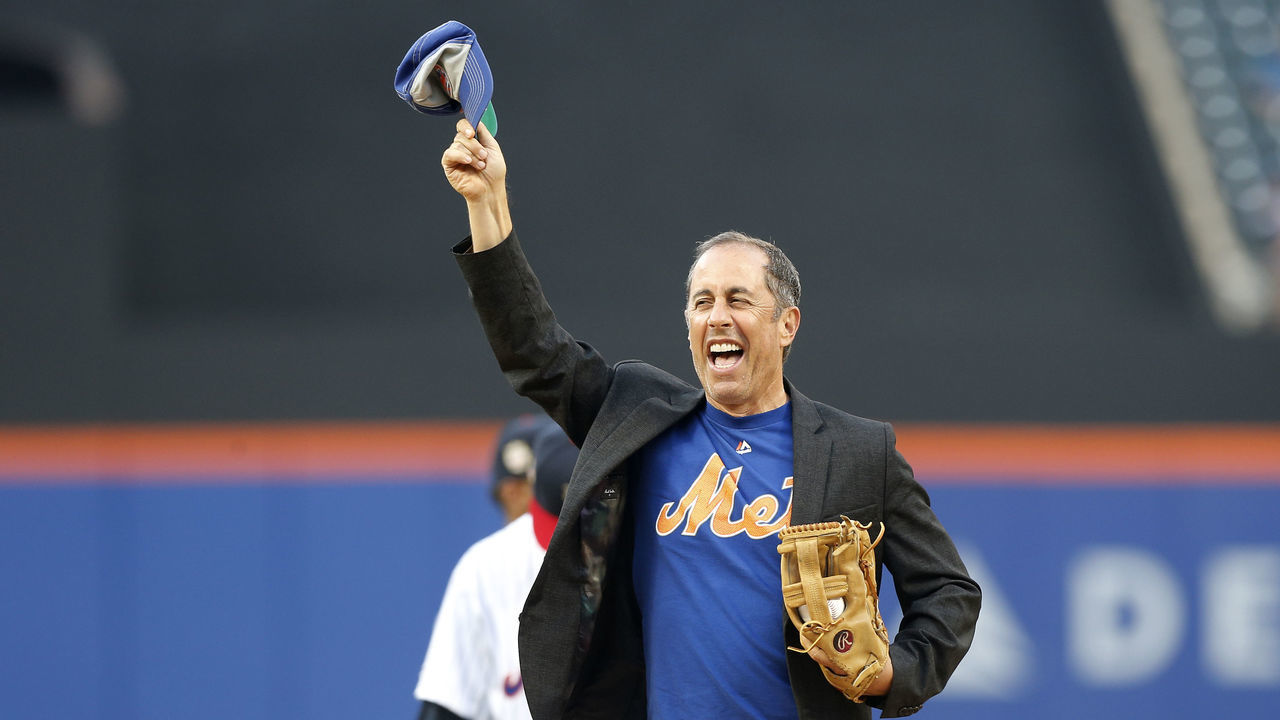 NEW YORK, NEW YORK - JULY 05: Comedian Jerry Seinfeld is introduced before throwing the ceremonial first pitch of a game between the New York Mets and the Philadelphia Phillies at Citi Field on July 05, 2019 in New York City. The Phillies defeated the Mets 7-2.