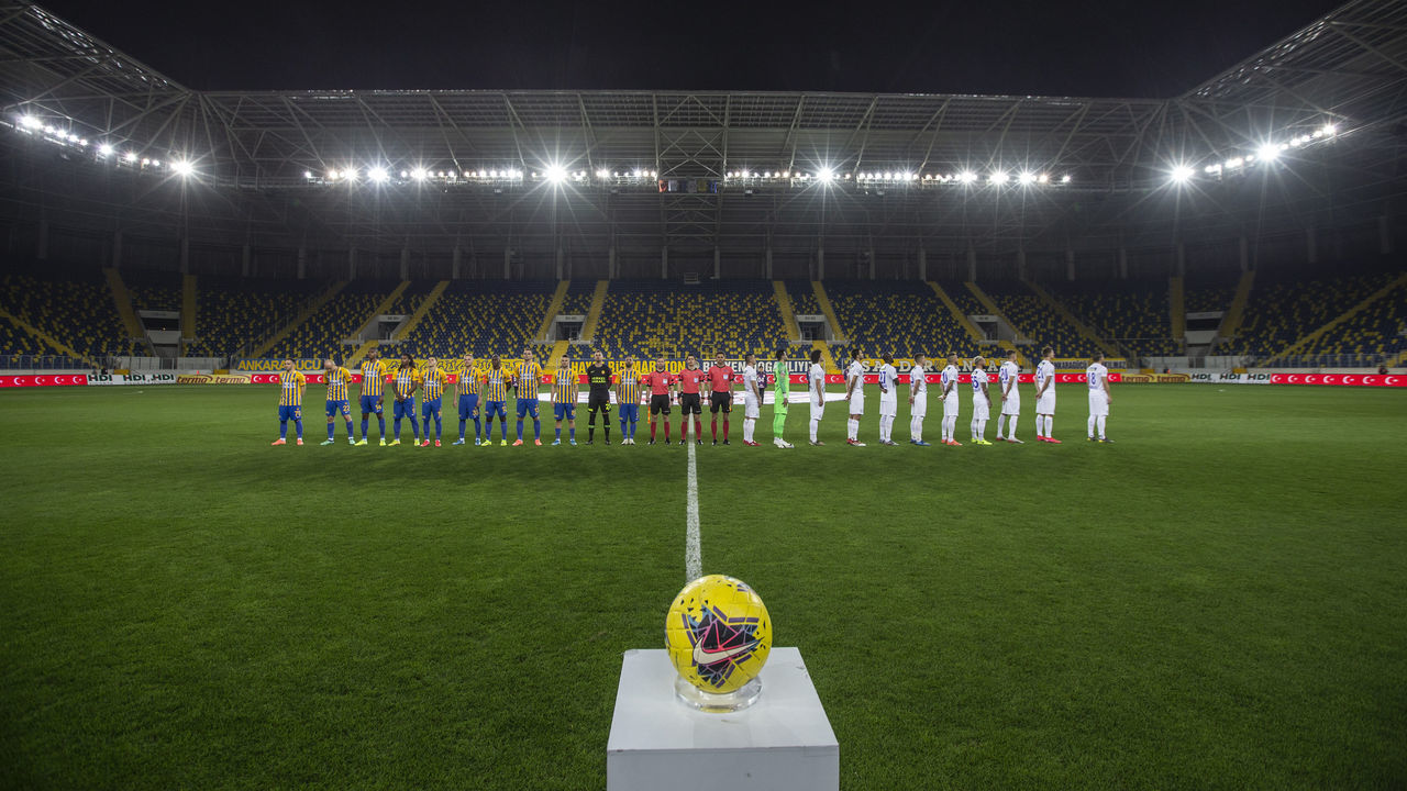 ANKARA, TURKEY - MARCH 13: Players of MKE Ankaragucu and Caykur Rizespor stand in silence ahead of the Turkish Super Lig soccer match between MKE Ankaragucu and Caykur Rizespor, which was played without spectators due to coronavirus (Covid-19) outbreak, in Ankara, Turkey on March 13, 2020.