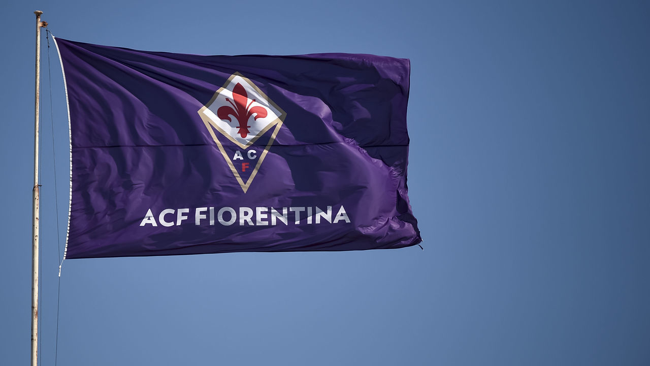 STADIO ARTEMIO FRANCHI, FLORENCE, ITALY - 2019/09/14: A flag of ACF Fiorentina waves prior to the Serie A football match between ACF Fiorentina and Juventus FC. The match ended in a 0-0 tie.