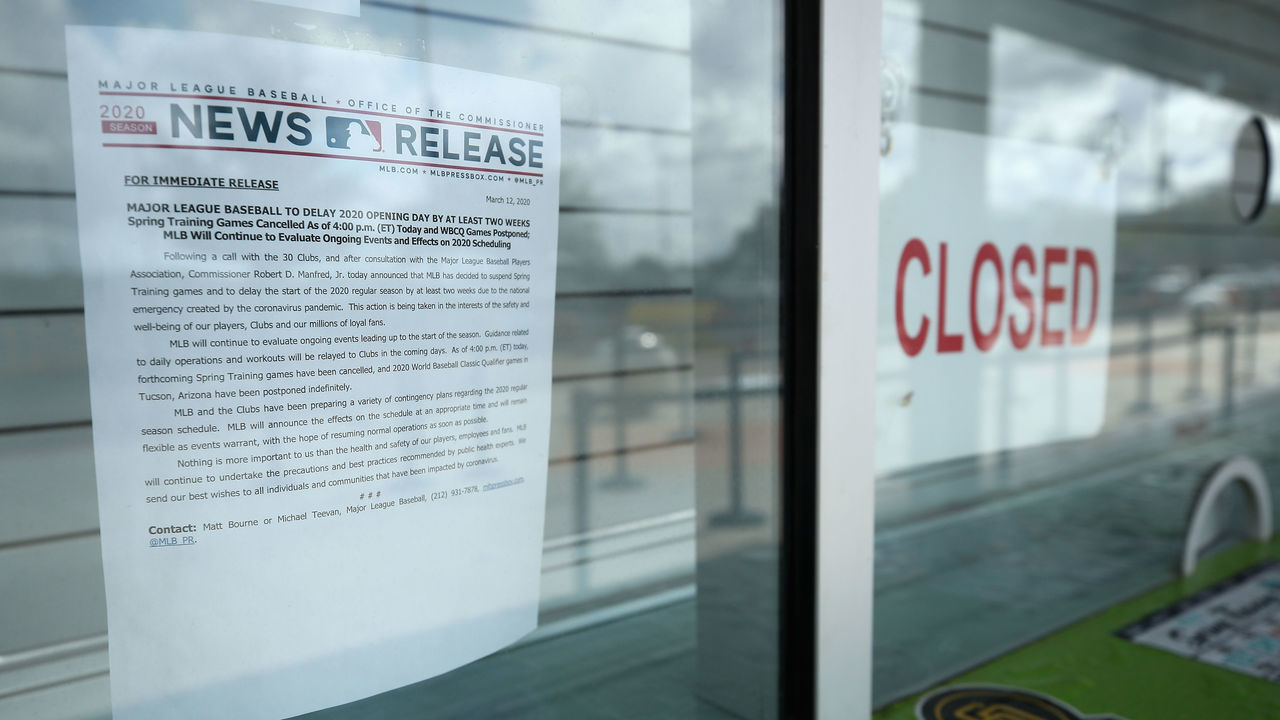 PEORIA, ARIZONA - MARCH 13: Closed signs and MLB news releases are displayed on box office windows outside of Peoria Stadium, home of the San Diego Padres and Seattle Mariners on March 13, 2020 in Peoria, Arizona. Major League Baseball cancelled spring training games and has delayed opening day by at least two weeks due to COVID-19.