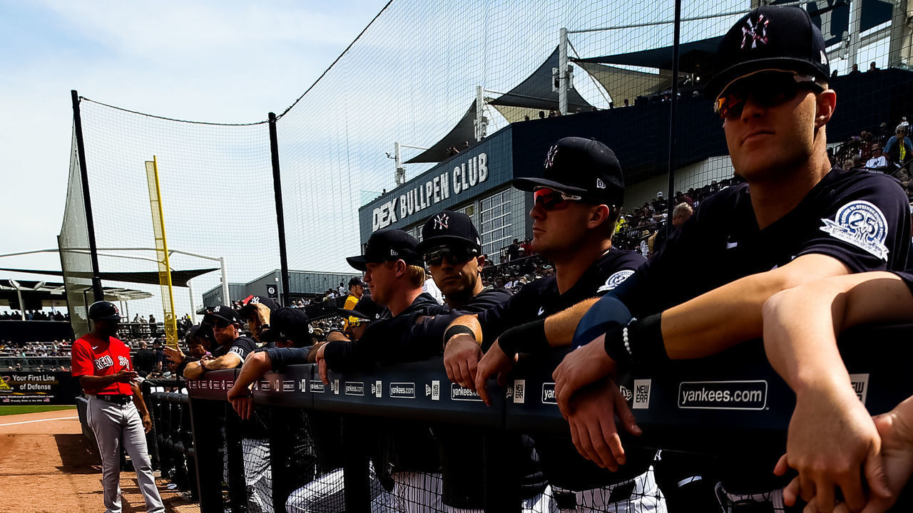 TAMPA, FL - MARCH 3: New York Yankees stand in the dugout during a spring training game against the Boston Red Sox at Steinbrenner Field on March 3, 2020 in Tampa, Florida.