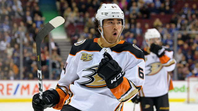 VANCOUVER, BC - MARCH 26: Anaheim Ducks Right Wing Kiefer Sherwood (64) celebrates after scoring a goal against the Vancouver Canucks during their NHL game at Rogers Arena on March 26, 2019 in Vancouver, British Columbia, Canada. Anaheim won 5-4.