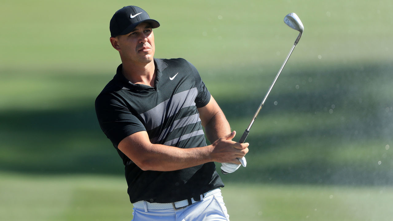 PONTE VEDRA BEACH, FLORIDA - MARCH 12: Brooks Koepka of the United States hits from a sand trap on the ninth hole during the first round of The PLAYERS Championship on The Stadium Course at TPC Sawgrass on March 12, 2020 in Ponte Vedra Beach, Florida.