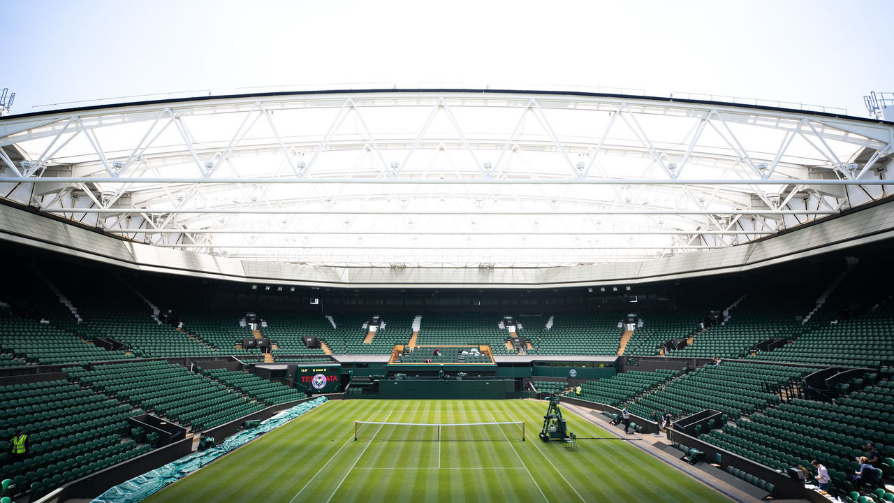 LONDON - ENGLAND JUNE 29: Center court being prepared for The Wimbledon Lawn Tennis Championship at the All England Lawn Tennis and Croquet Club at Wimbledon on June 29th, 2018 in London, England.