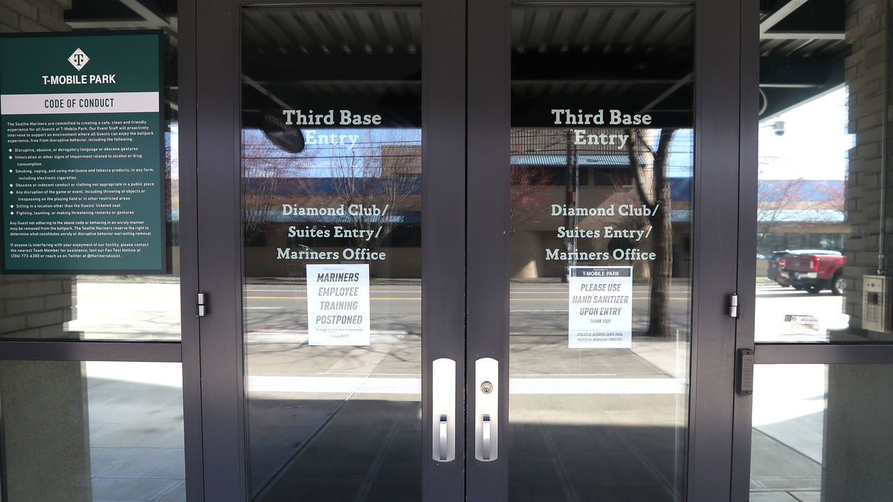 SEATTLE, WASHINGTON - MARCH 15: A general view of signage on the doors of T-Mobile Park on March 15, 2020 in Seattle, Washington. Major League Baseball cancelled spring training games and has delayed opening day by at least two weeks due to the coronavirus (COVID-19) outbreak.