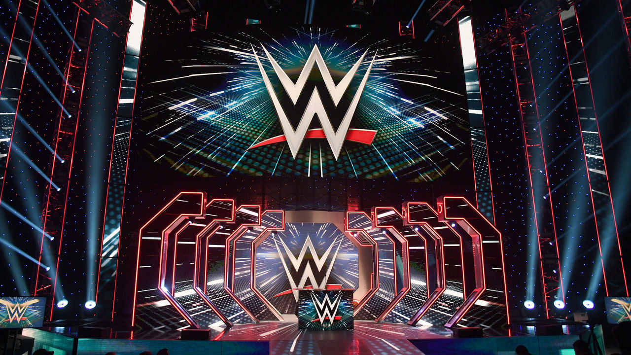 LAS VEGAS, NEVADA - OCTOBER 11: WWE logos are shown on screens before a WWE news conference at T-Mobile Arena on October 11, 2019 in Las Vegas, Nevada. It was announced that WWE wrestler Braun Strowman will face heavyweight boxer Tyson Fury and WWE champion Brock Lesnar will take on former UFC heavyweight champion Cain Velasquez at the WWE's Crown Jewel event at Fahd International Stadium in Riyadh, Saudi Arabia on October 31.