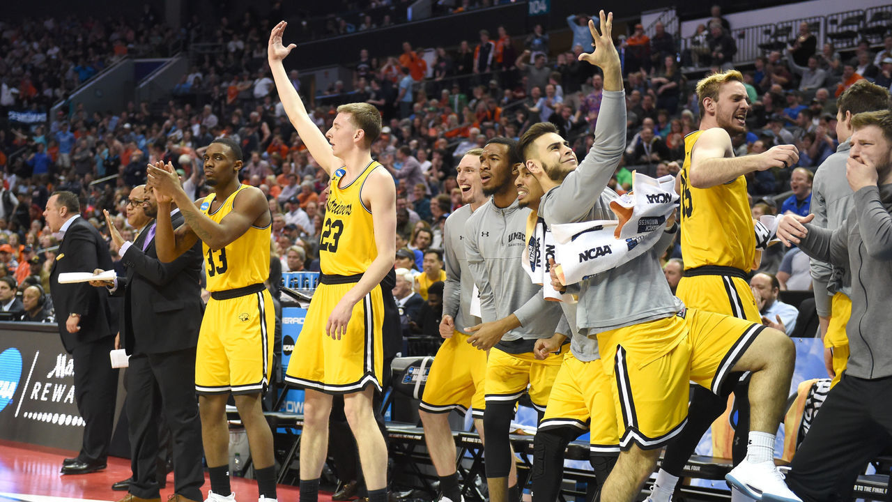 CHARLOTTE, NC - MARCH 16: The UMBC Retrievers celebrate a basket during the first round of the 2018 NCAA Men's Basketball Tournament against the Virginia Cavaliers at the Spectrum Center on March 16, 2018 in Charlotte, North Carolina. The Retrievers won 74-54. Photo by Mitchell Layton/Getty Images) *** Local Caption ***