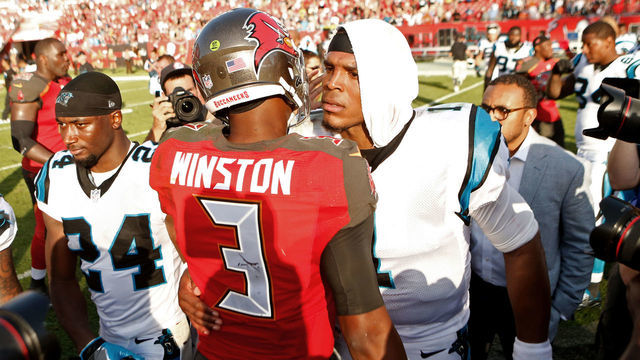 TAMPA, FL - JANUARY 1: Quarterback Jameis Winston #3 of the Tampa Bay Buccaneers speaks with quarterback Cam Newton #1 of the Carolina Panthers following the Buccaneers' 17-16 win over the Panthers at an NFL game on January 1, 2017 at Raymond James Stadium in Tampa, Florida.