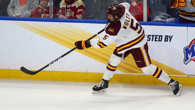 BUFFALO, NY - APRIL 13: Minnesota Duluth Bulldogs Defenseman Nick Wolff (5) shoots the puck in on goal during the NCAA Men's Frozen Four championship game between Massachusetts Minutemen and Minnesota Duluth Bulldogs on April 13, 2019 at KeyBank Center in Buffalo, NY. .