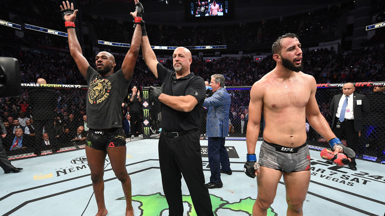 HOUSTON, TEXAS - FEBRUARY 08: (L-R) Jon Jones celebrates his victory over Dominick Reyes in their light heavyweight championship bout during the UFC 247 event at Toyota Center on February 08, 2020 in Houston, Texas.