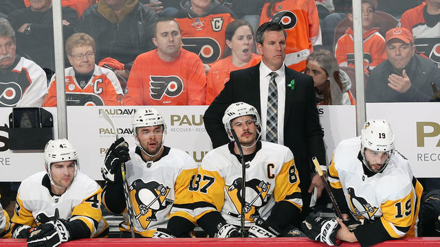 PHILADELPHIA, PA - APRIL 18: Head Coach of the Pittsburgh Penguins Mike Sullivan looks on during the first period behind Conor Sheary #43, Dominik Simon #12, Sidney Crosby #87 and Derick Brassard #19 against the Philadelphia Flyers in Game Four of the Eastern Conference First Round during the 2018 NHL Stanley Cup Playoffs at the Wells Fargo Center on April 18, 2018 in Philadelphia, Pennsylvania.