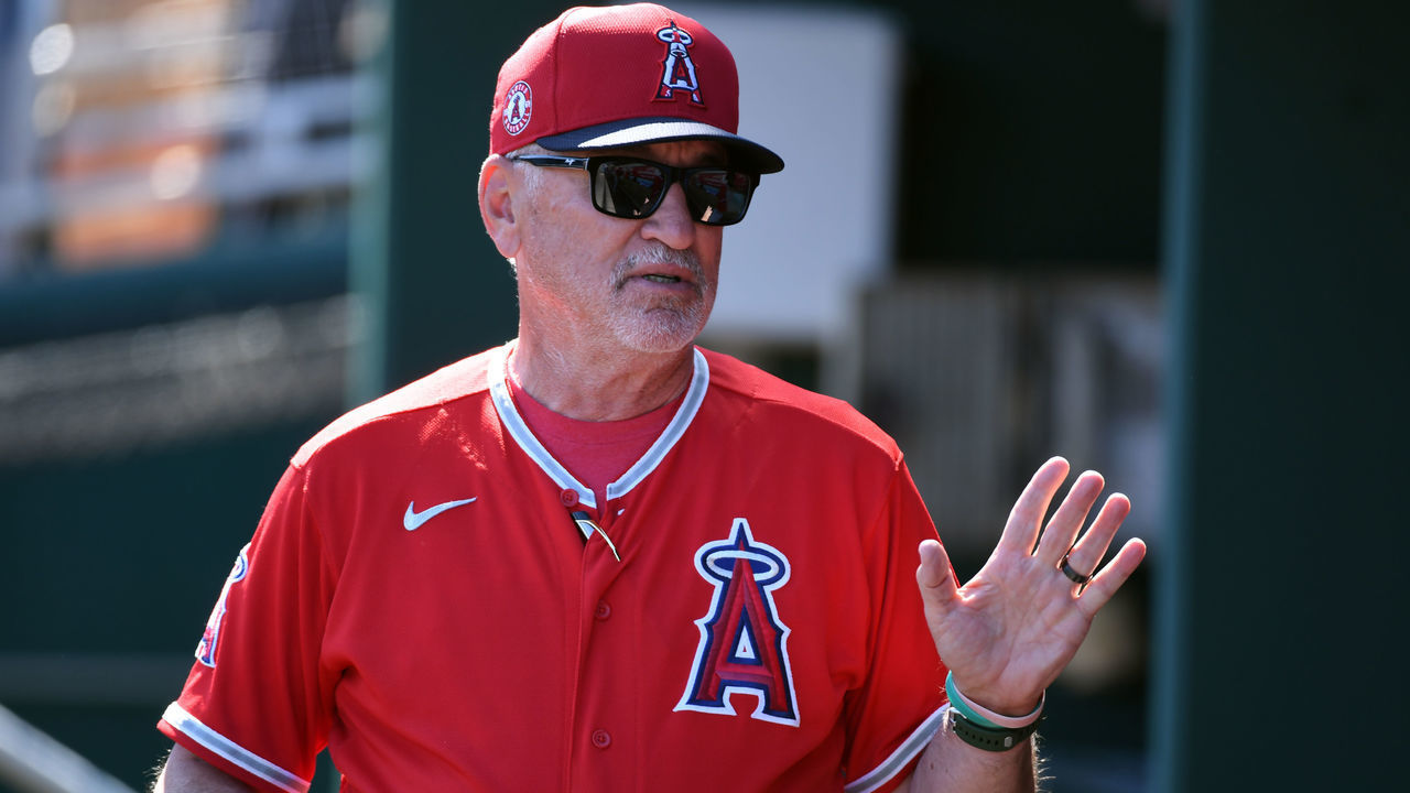 GOODYEAR, ARIZONA - MARCH 03: Manager Joe Maddon #70 of the Los Angeles Angels talks with his players in the dugout prior to a spring training game against the Cleveland Indians at Goodyear Ballpark on March 03, 2020 in Goodyear, Arizona.