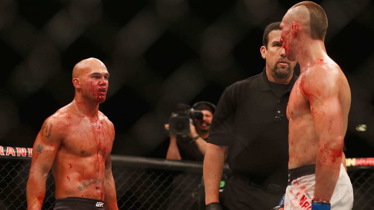 LAS VEGAS, NV - JULY 11: (L-R) Robbie Lawler and Rory MacDonald exchange words in their UFC welterweight title fight during the UFC 189 event inside MGM Grand Garden Arena on July 11, 2015 in Las Vegas, Nevada.