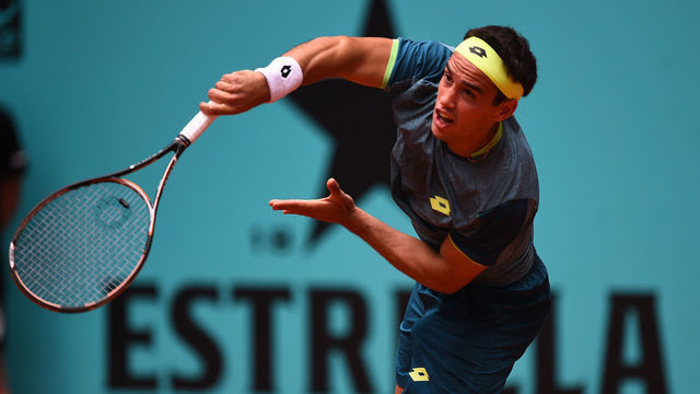 MADRID, SPAIN - MAY 07: Nicolas Kicker of Argentina returns a shot to Milos Raonic of Canada during his 1st Round match in day three of the Mutua Madrid Open tennis tournament at the Caja Magica on May 7, 2018 in Madrid, Spain.