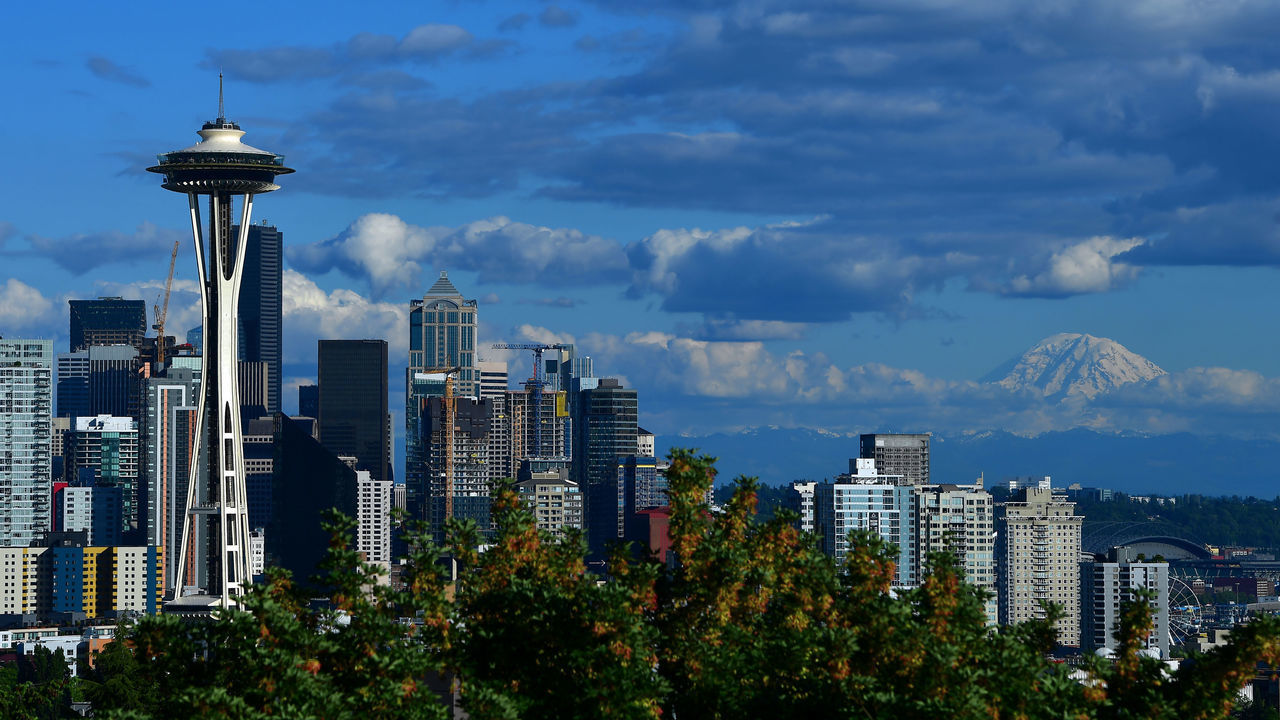 SEATTLE, WA - JUNE 8: A general view of the Seattle Space Needle and downtown skyline with Mount Rainier in the background leading up to the 2019 Rock'n'Roll Seattle Marathon and 1/2 Marathon on June 8, 2019 in Seattle, Washington.