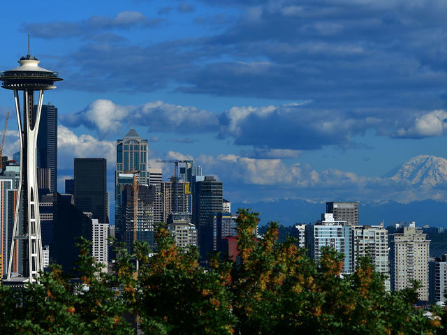 SEATTLE, WA - JUNE 8: A general view of the Seattle Space Needle and downtown skyline with Mount Rainier in the background leading up to the 2019 Rock'n'Roll Seattle Marathon and 1/2 Marathon on June 8, 2019 in Seattle, Washington.