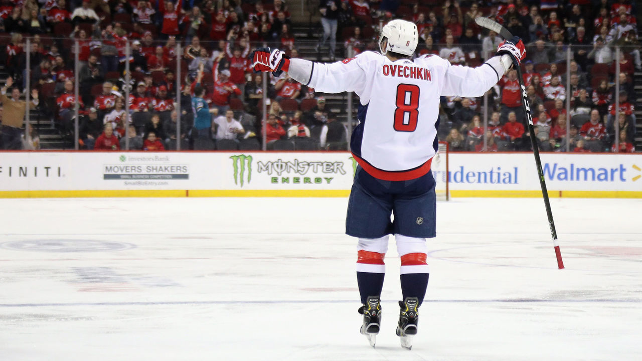 NEWARK, NEW JERSEY - FEBRUARY 22: Alex Ovechkin #8 of the Washington Capitals celebrates his goal at 4:50 of the third period against the New Jersey Devils at the Prudential Center on February 22, 2020 in Newark, New Jersey. With the goal, Ovechkin became the eight player in NHL history to score 700 goals. The Devils defeated the Capitals 3-2.