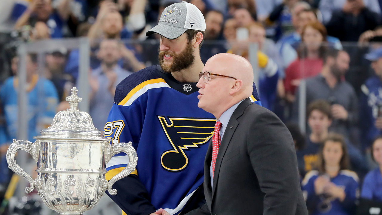 ST LOUIS, MISSOURI - MAY 21: NHL Deputy Commissioner Bill Daly shakes hands with Alex Pietrangelo #27 prior to presenting the Clarence S. Campbell Bowl to the St. Louis Blues after defeating the San Jose Sharks in Game Six with a score of 5 to 1 to win the Western Conference Finals during the 2019 NHL Stanley Cup Playoffs at Enterprise Center on May 21, 2019 in St Louis, Missouri.