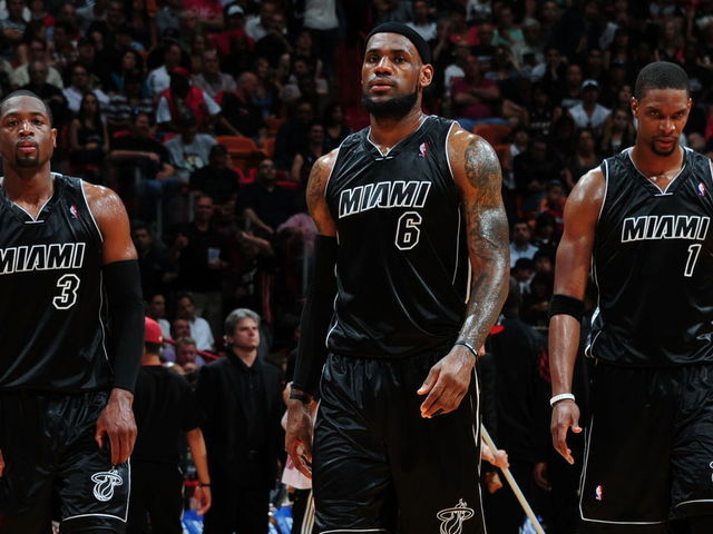 MIAMI, FL - APRIL 10: Teammates Dwyane Wade #3, LeBron James #6 and Chris Bosh #1 of the Miami Heat during the game on April 10, 2012 at American Airlines Arena in Miami, Florida. NOTE TO USER: User expressly acknowledges and agrees that, by downloading and/or using this Photograph, user is consenting to the terms and conditions of the Getty Images License Agreement. Mandatory Copyright Notice: Copyright 2012 NBAE