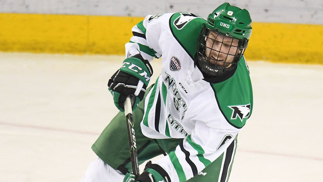 GRAND FORKS, ND - FEBRUARY 10: University of North Dakota Defenceman Colton Poolman (6) makes a pass during a college hockey game between the University of North Dakota and Colorado College on February 10, 2018 at Ralph Engelstad Arena in Grand Forks, ND. North Dakota defeated Colorado College 5-1.