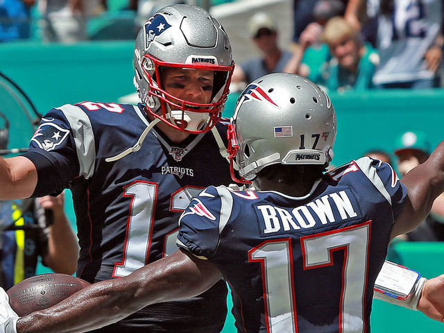 MIAMI , MA. - SEPTEMBER 15: Tom Brady #12 of the New England Patriots celebrates Antonio Brown's #17 touchdown during the second quarter of the NFL game against the Miami Dolphins at the Hard Rock Stadium on September 15, 2019 in Miami , Florida. (Staff Photo By Matt Stone/MediaNews Group/Boston Herald)