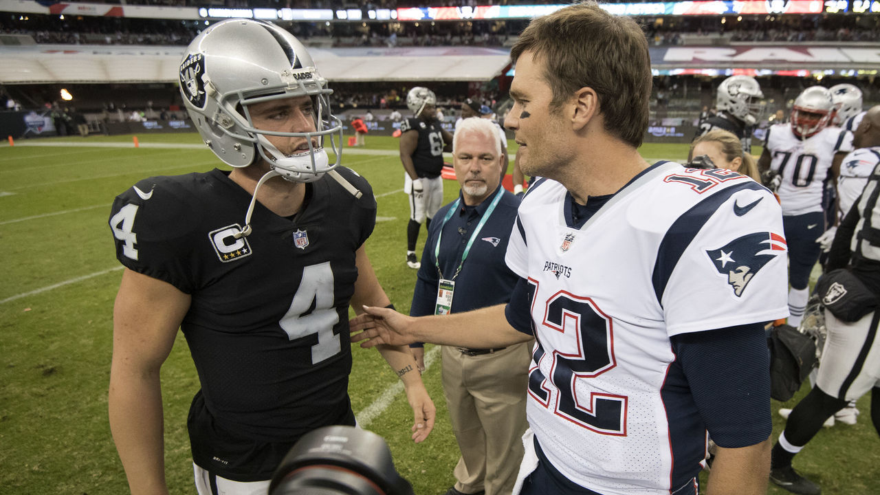 MEXICO CITY, MEXICO - NOVEMBER 19: Tom Brady #12 of the New England Patriots and Derek Carr #4 of the Oakland Raiders shake hands after the game at Estadio Azteca on November 19, 2017 in Mexico City, Mexico.