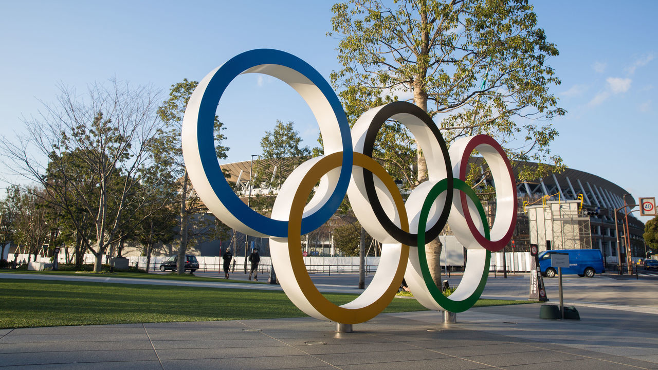 TOKYO, JAPAN - 2020/02/17: View of the Olympic Rings near the new National Stadium in Kasumigaoka, Shinjuku, Tokyo, Japan. The stadium will serve as the main stadium for the opening and closing ceremonies and for the track and field events at the Tokyo 2020 Summer Olympic Games and Paralympic Games.