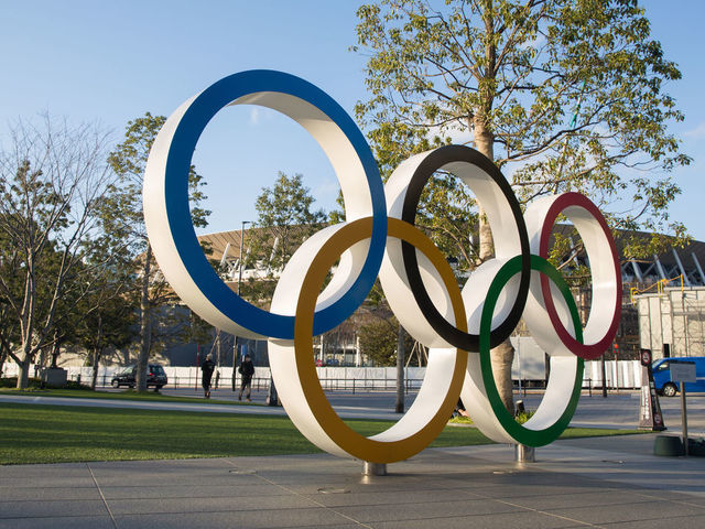 TOKYO, JAPAN - 2020/02/17: View of the Olympic Rings near the new National Stadium in Kasumigaoka, Shinjuku, Tokyo, Japan. The stadium will serve as the main stadium for the opening and closing ceremonies and for the track and field events at the Tokyo 2020 Summer Olympic Games and Paralympic Games.