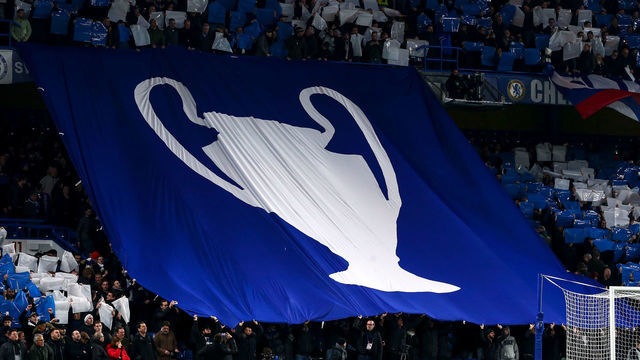 LONDON, ENGLAND - FEBRUARY 25: Fans of Chelsea hold up a tifo display with a giant UEFA Champions League trophy on during the UEFA Champions League round of 16 first leg match between Chelsea FC and FC Bayern Muenchen at Stamford Bridge on February 25, 2020 in London, United Kingdom.