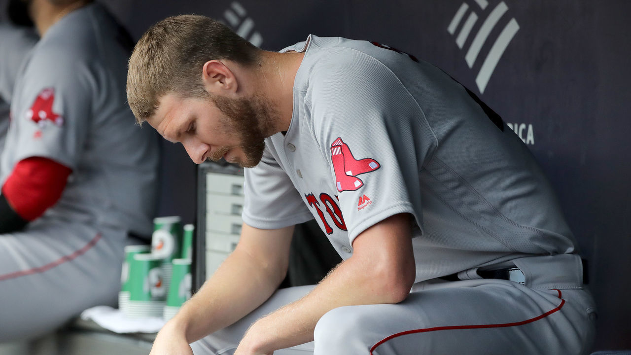NEW YORK, NEW YORK - AUGUST 03: Chris Sale #41 of the Boston Red Sox sits in the dugout in the second inning as his team bats against the New York Yankees during game one of a double header at Yankee Stadium on August 03, 2019 in the Bronx borough of New York City.