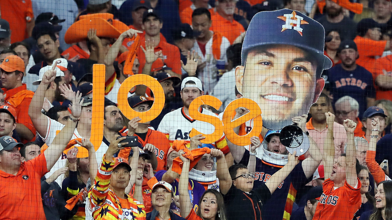 HOUSTON, TEXAS - OCTOBER 29: Fans hold signs referencing Jose Altuve (not pictured) of the Houston Astros during the eighth inning in Game Six of the 2019 World Series between the Houston Astros and the Washington Nationals at Minute Maid Park on October 29, 2019 in Houston, Texas.