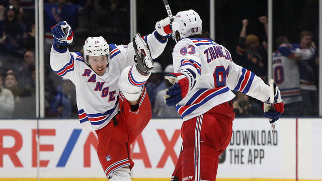 NEW YORK, NEW YORK - FEBRUARY 25: (L-R) Artemi Panarin #10 and Mika Zibanejad #93 of the New York Rangers celebrate an game winning overtime goal by Zibanejad against the New York Islanders at NYCB Live's Nassau Coliseum on February 25, 2020 in Uniondale, New York.