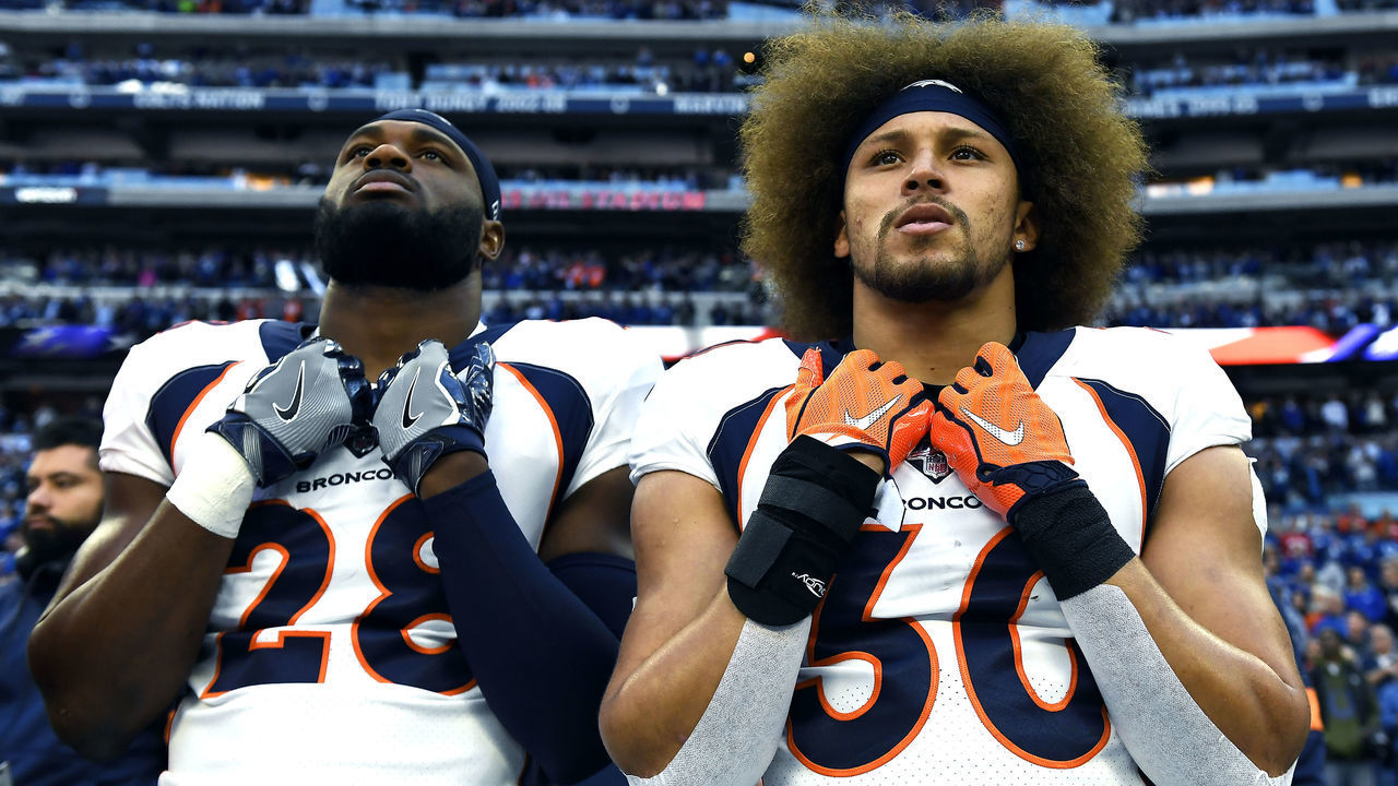 INDIANAPOLIS, IN - OCTOBER 27: Denver Broncos running back Royce Freeman #28 and running back Phillip Lindsay #30 during the National Anthem before the (2-5) Denver Broncos take on the (4-2) Indianapolis Colts at Lucas Oil Stadium in Indianapolis, Indiana on October 27, 2019.