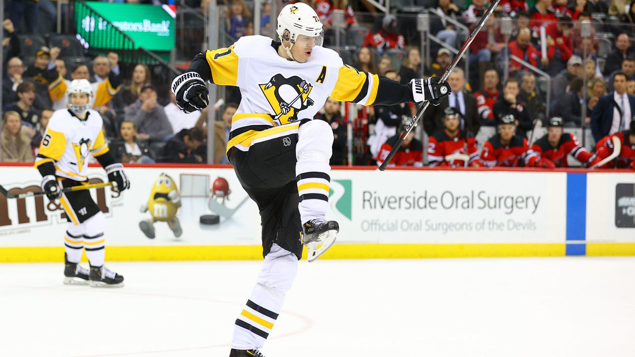 NEWARK, NJ - MARCH 10: Pittsburgh Penguins center Evgeni Malkin (71) celebrates after scoring his second goal of the third period of the National Hockey League game between the New Jersey Devils and the Pittsburgh Penguins on March 10, 2020 at the Prudential Center in Newark, NJ.