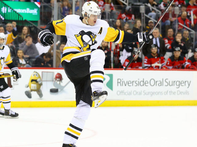 NEWARK, NJ - MARCH 10: Pittsburgh Penguins center Evgeni Malkin (71) celebrates after scoring his second goal of the third period of the National Hockey League game between the New Jersey Devils and the Pittsburgh Penguins on March 10, 2020 at the Prudential Center in Newark, NJ.