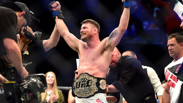 INGLEWOOD, CA - JUNE 04: Michael Bisping of England celebrates after his first round knockout win against Luke Rockhold in their UFC middleweight championship bout during the UFC 199 event at The Forum on June 4, 2016 in Inglewood, California.