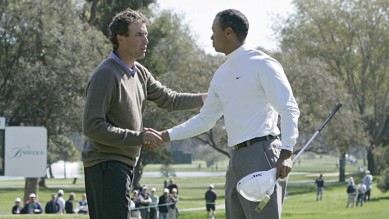 Stephen Ames congratulates Tiger Woods after Woods won their match during the first round of the 2006 Accenture Match Play Championship at the La Costa Resort & Spa in Carlsbad, California on February 22, 2006.
