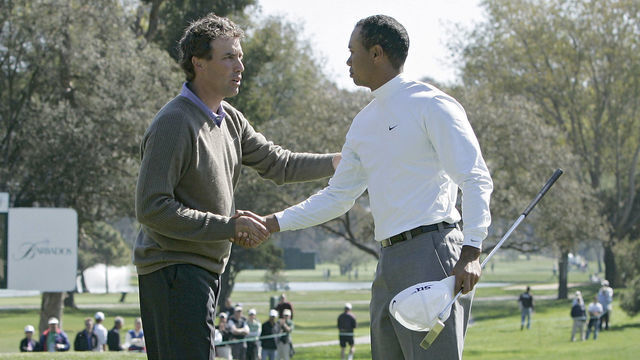Stephen Ames congratulates Tiger Woods after Woods won their match during the first round of the 2006 Accenture Match Play Championship at the La Costa Resort & Spa in Carlsbad, California on February 22, 2006.