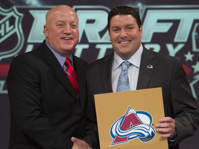 TORONTO, ON - APRIL 29: NHL Deputy Commissioner Bill Daly, with Colorado Avalanche's Rick Pracey, Director of Amateur Scouting, with the "golden ticket" which gives the Avalanche the 1st overall pick in the NHL Draft, at the TSN studios in Scarborough. (Rick Madonik/Toronto Star via Getty Images)
