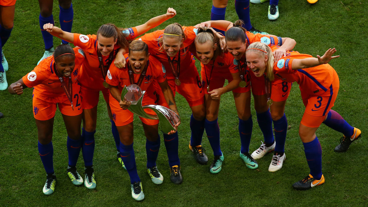 ENSCHEDE, NETHERLANDS - AUGUST 06: The team of the Netherlands celebrates with the winning lifts the trophy on the podium after winning after the Netherlands v Denmark - UEFA Women's Euro 2017 Final at De Grolsch Veste Stadium on August 6, 2017 in Enschede, Netherlands.