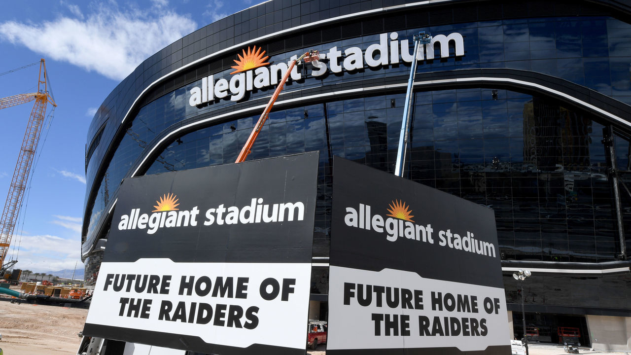 LAS VEGAS, NEVADA - MARCH 17: Workers adjust the newly installed sign at Allegiant Stadium as construction continues at the USD 2 billion, glass-domed future home of the Las Vegas Raiders on March 17, 2020 in Las Vegas, Nevada. The Raiders and the UNLV Rebels football teams are scheduled to begin play at the 65,000-seat facility in their 2020 seasons.