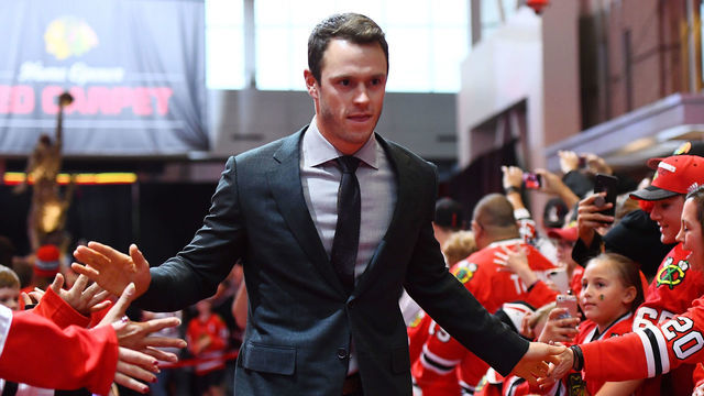 CHICAGO, ILLINOIS - OCTOBER 10: Jonathan Toews #19 of the Chicago Blackhawks greets fans during a red carpet event prior to the home opening game against the San Jose Sharks at United Center on October 10, 2019 in Chicago, Illinois.