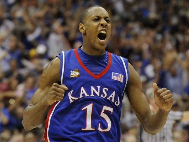 07 APR 2008: Mario Chalmers (15) of the University of Kansas celebrates after hitting a three point basket to send the game into overtime during the Division I Men's Final Four Basketball Championship Game held at the Alamodome in San Antonio, TX. Kansas defeated Memphis 75-68 to claim the championship title. Ryan McKee/NCAA Photos via Getty Images