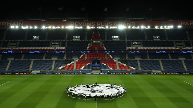 PARIS, FRANCE - MARCH 11: (FREE FOR EDITORIAL USE) In this handout image provided by UEFA, General view inside the empty stadium as the two teams line up prior to the UEFA Champions League round of 16 second leg match between Paris Saint-Germain and Borussia Dortmund at Parc des Princes on March 11, 2020 in Paris, France. The match is played behind closed doors as a precaution against the spread of COVID-19 (Coronavirus).