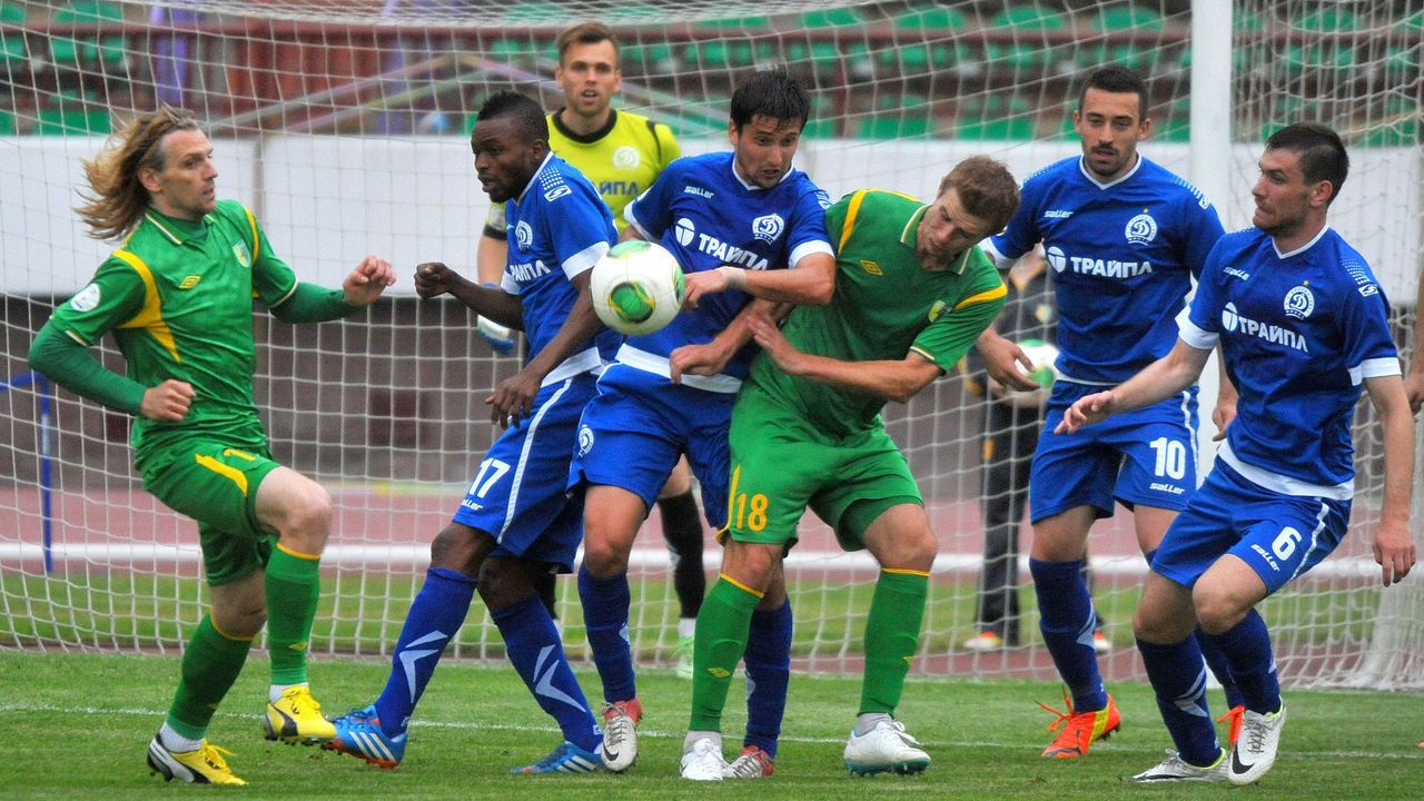GRODNO,BELARUS - JUNE 15: Pavel Rybak of FC Neman Grodno (#18) vies for the ball during the Belarusian Premier League match between FC Neman Grodno and FC Dinamo Minsk at the Neman Stadium on June 15,2014 in Grodno,Belarus.