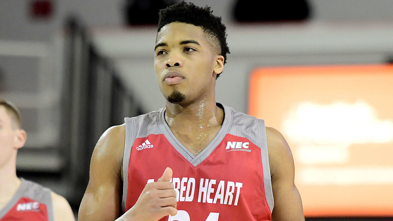 NEW YORK, NEW YORK - DECEMBER 22: E.J. Anosike #24 of the Sacred Heart Pioneers reacts against the St. John's Red Storm at Carnesecca Arena on December 22, 2018 in New York City.